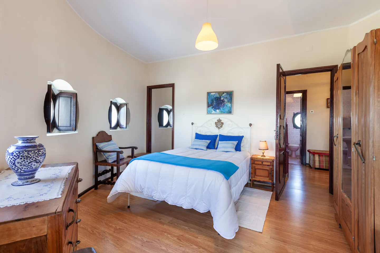 Bright double bedroom with blue accents